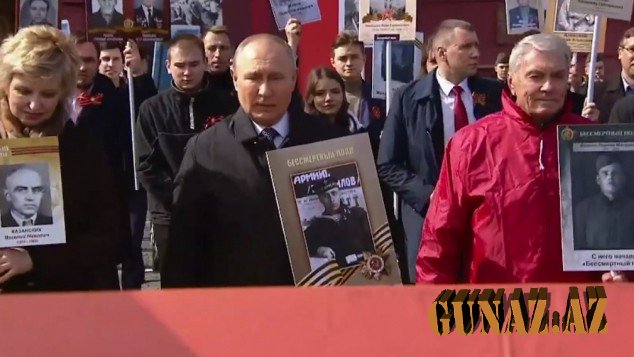 Putin yürüşə atasının fotosu ilə qatıldı