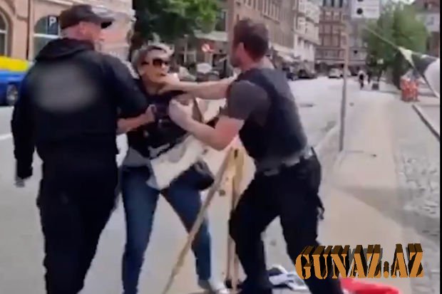 “Quran”ın yandırılmasına qarşı çıxan qadına polisdən sərt davranış